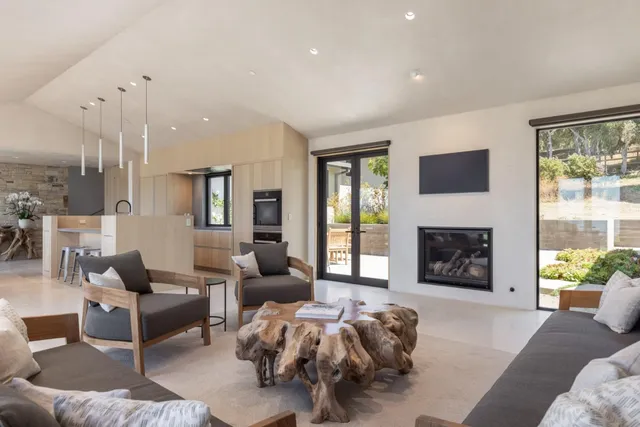 a living room with furniture fireplace and a flat screen tv