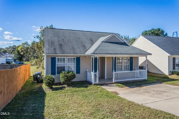 front view of a house with a yard