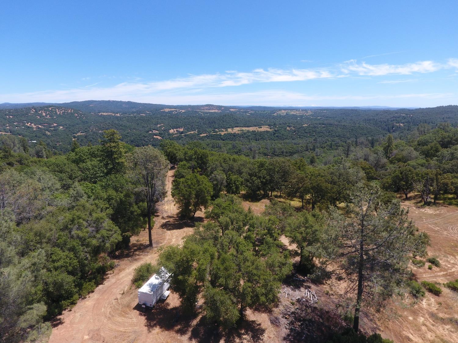 14210 Perimeter Road Grass Valley, CA 95949 - Photo 5 of 33 a view of a city with lush green forest
