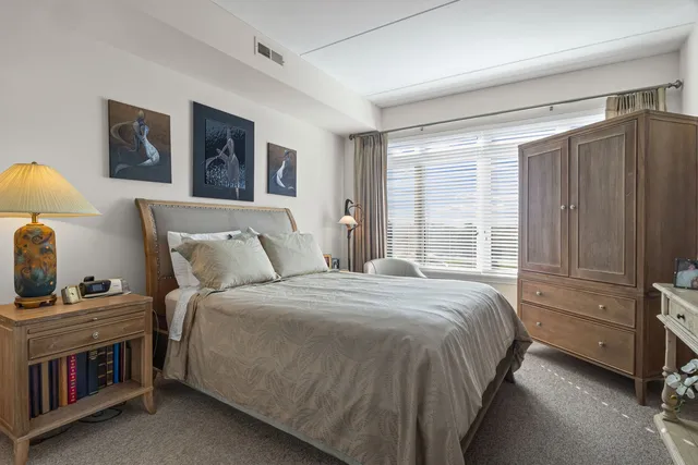 a bedroom with a bed and a cabinets