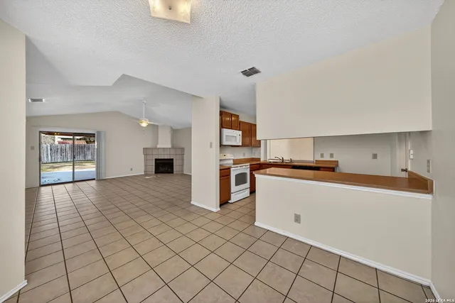 a view of a livingroom with a ceiling fan and window