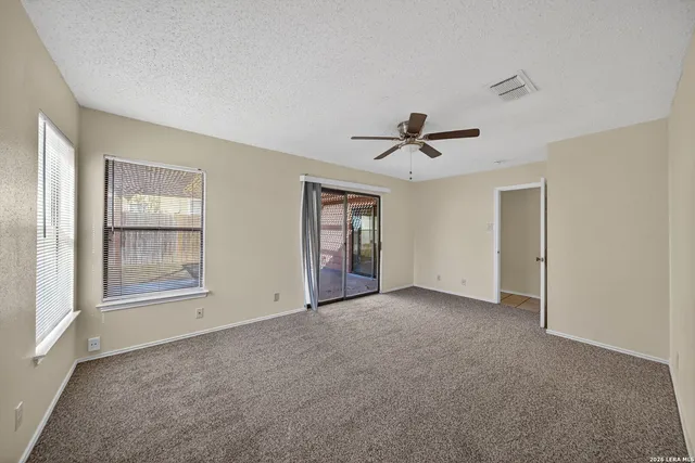 a spacious bathroom with a tub shower and sink