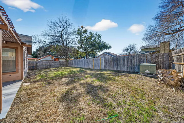 a view of a house with a yard and chandelier