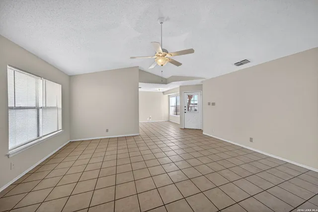 a view of an empty room with a window