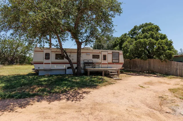 a house with trees in front of it