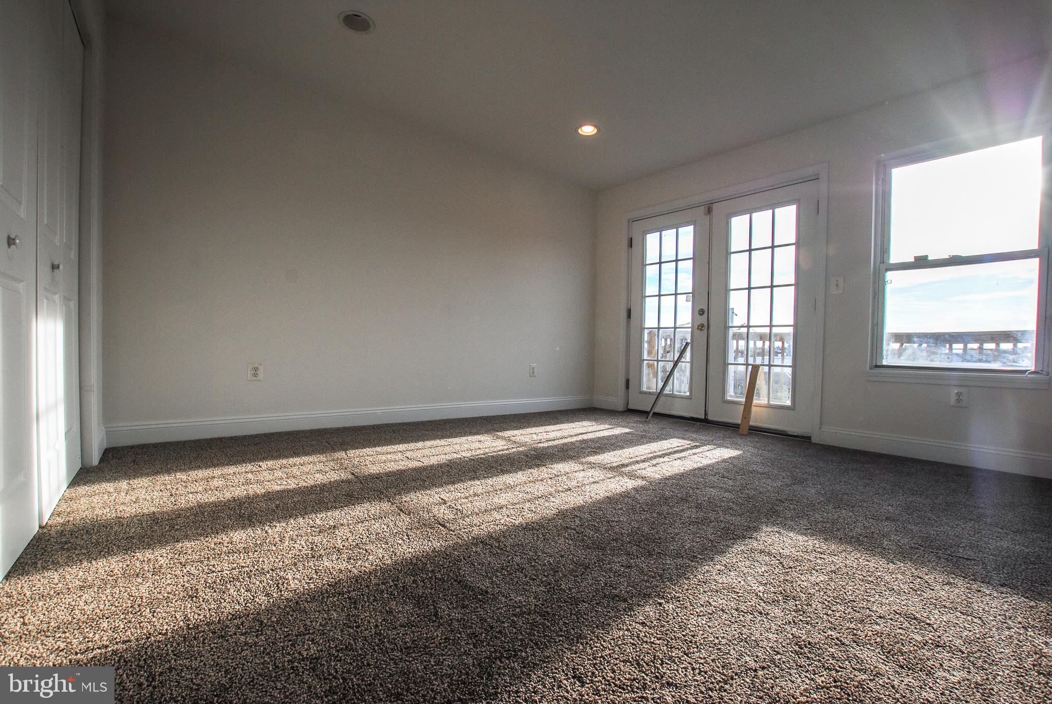 2210 Eutaw Place, Unit 3 Baltimore, MD 21217 - Photo 8 of 12 a view of an empty room with a window