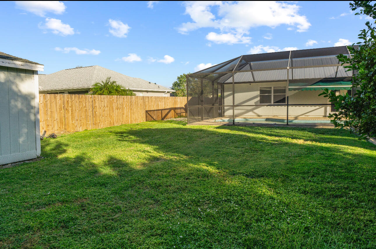 2230 Southeast Dill Lane Port St. Lucie, FL 34952 - Photo 14 of 15 a view of a back yard of the house