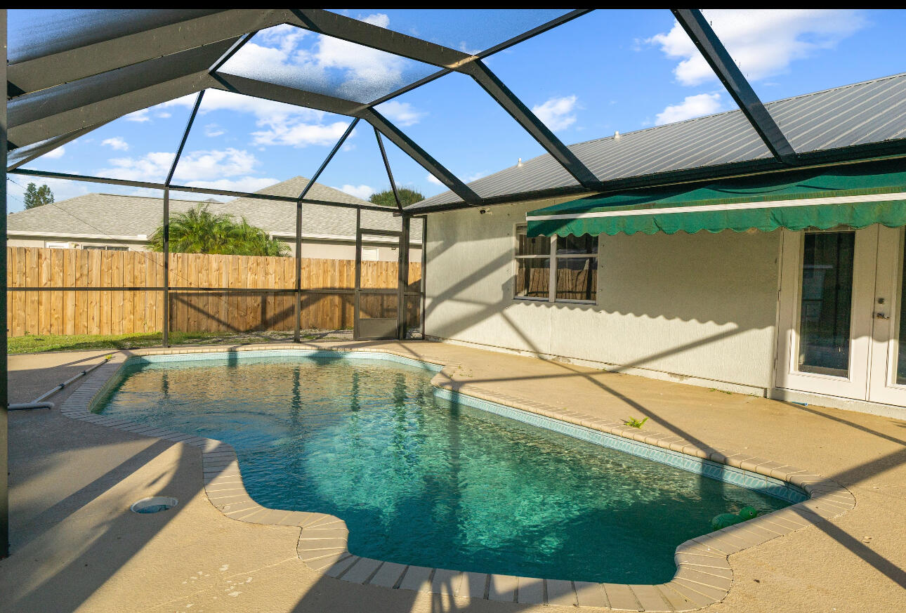 2230 Southeast Dill Lane Port St. Lucie, FL 34952 - Photo 15 of 15 a view of swimming pool with a yard