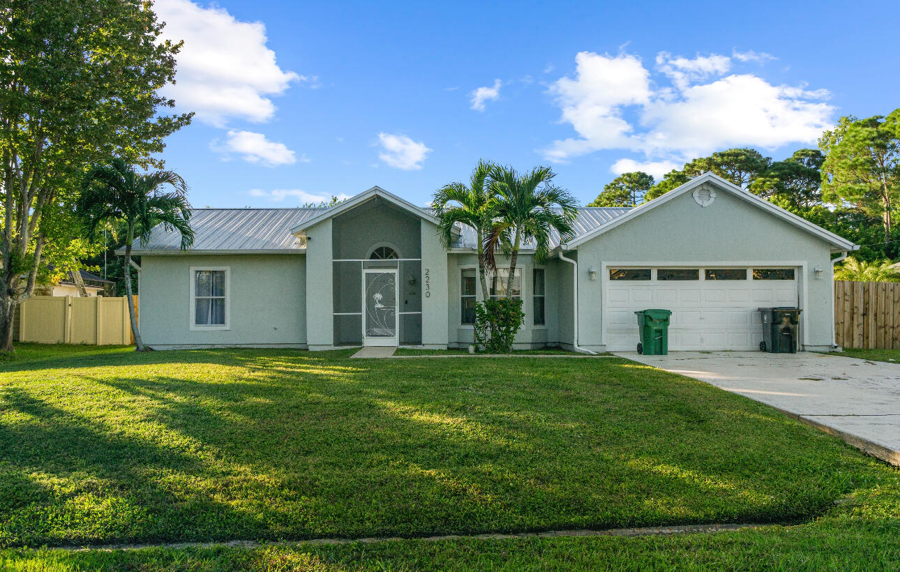 2230 Southeast Dill Lane Port St. Lucie, FL 34952 - Photo 2 of 15 a front view of house with yard and green space