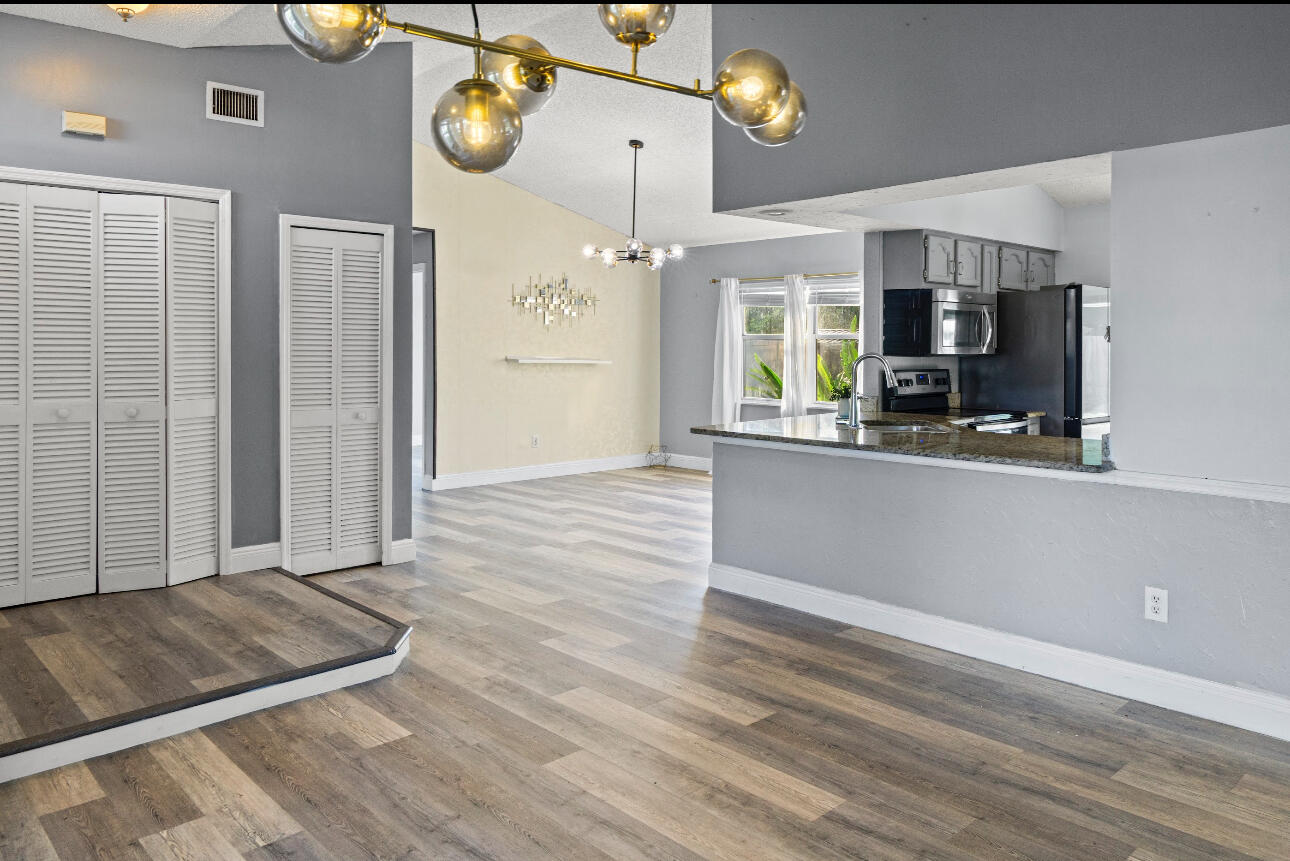 2230 Southeast Dill Lane Port St. Lucie, FL 34952 - Photo 3 of 15 a view of an entryway with wooden floor