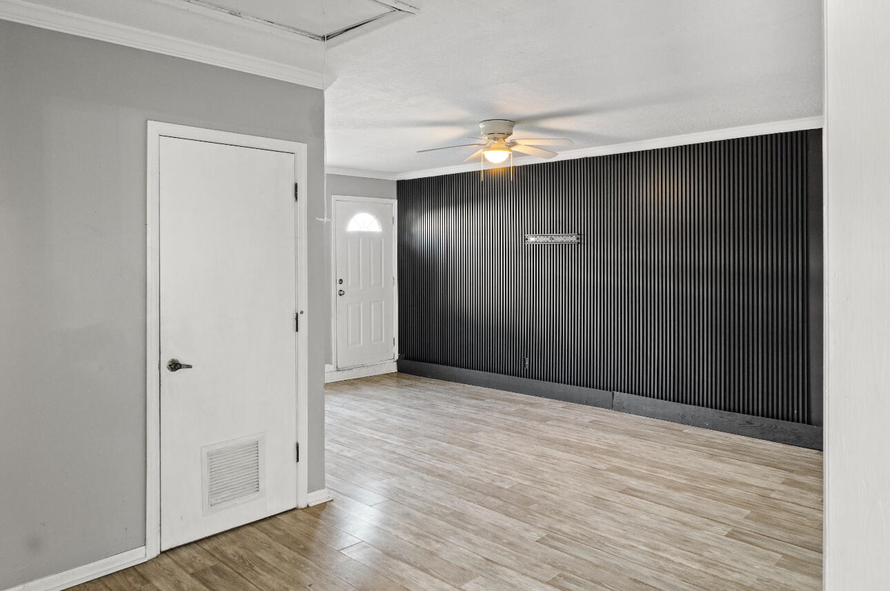 2230 Southeast Dill Lane Port St. Lucie, FL 34952 - Photo 6 of 15 a view of an empty room with wooden floor