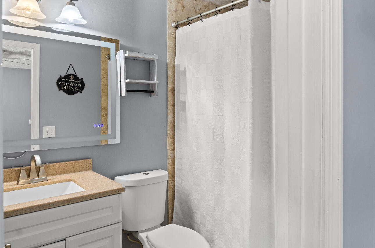 2230 Southeast Dill Lane Port St. Lucie, FL 34952 - Photo 7 of 15 a bathroom with a sink and toilet