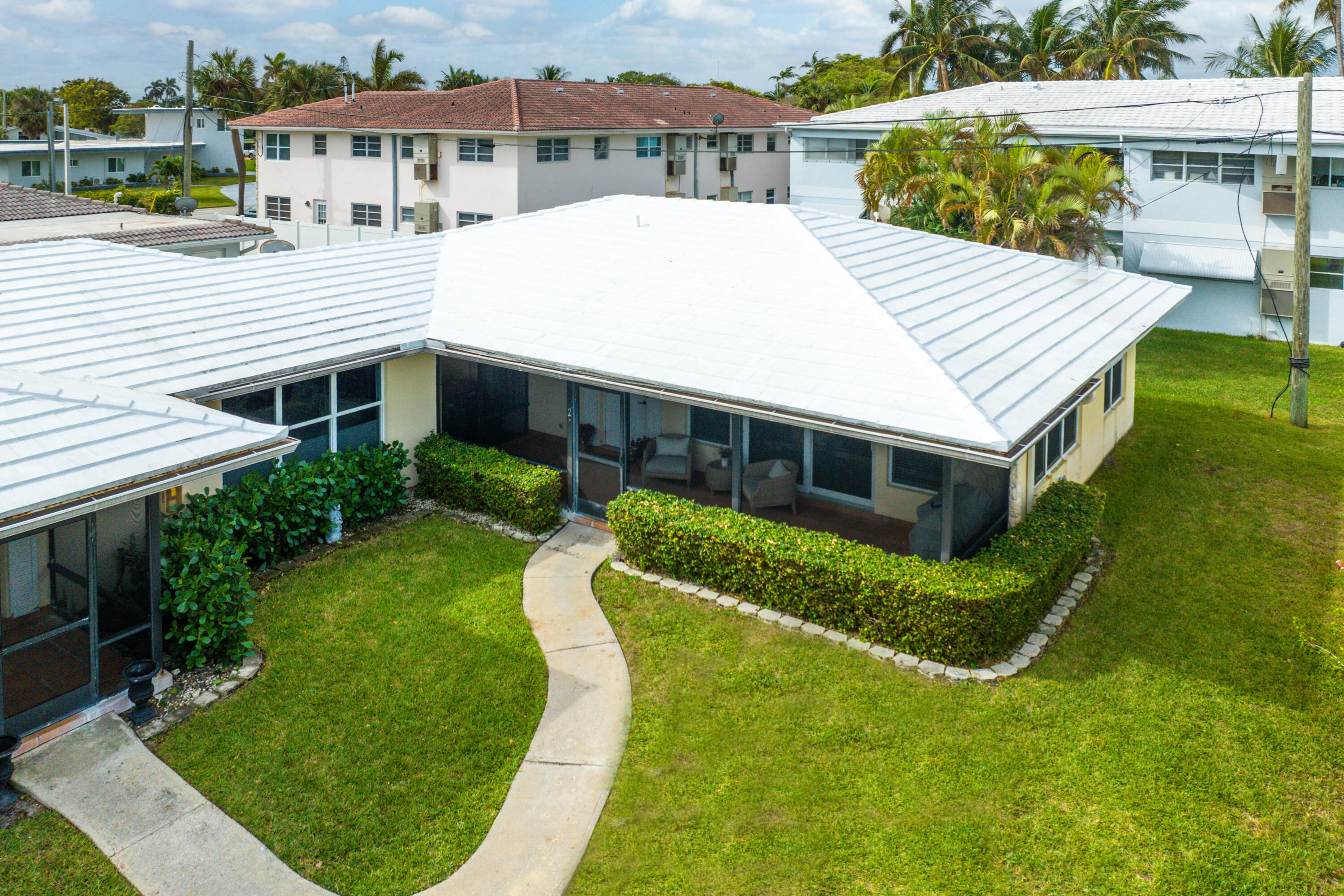 2757 Northeast 29th Avenue, Unit 2 Lighthouse Point, FL 33064 - Photo 28 of 29 a aerial view of a house with swimming pool and a yard