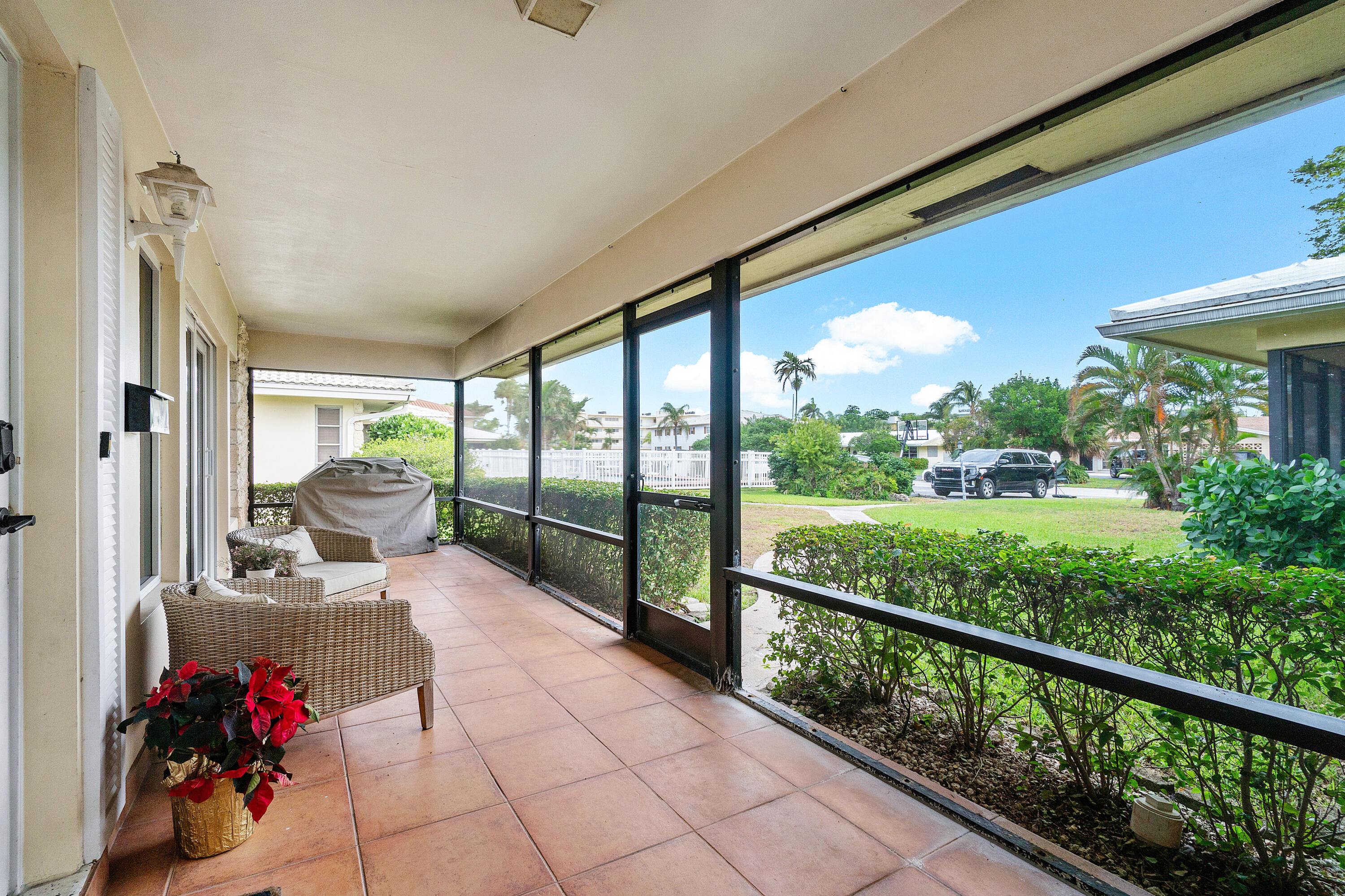 2757 Northeast 29th Avenue, Unit 2 Lighthouse Point, FL 33064 - Photo 5 of 29 a view of a porch with furniture and floor to ceiling window