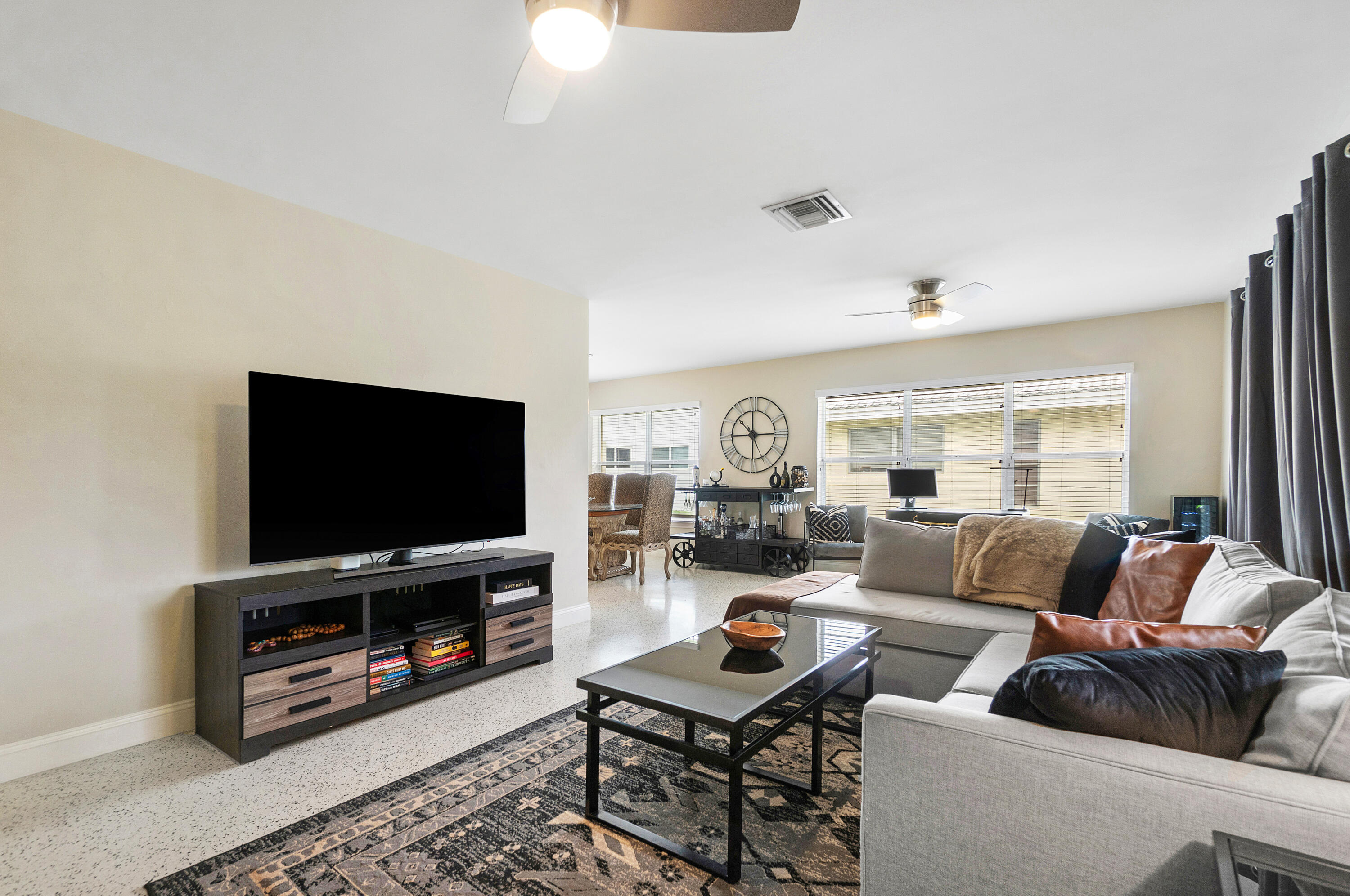 2757 Northeast 29th Avenue, Unit 2 Lighthouse Point, FL 33064 - Photo 6 of 29 a living room with furniture and a flat screen tv