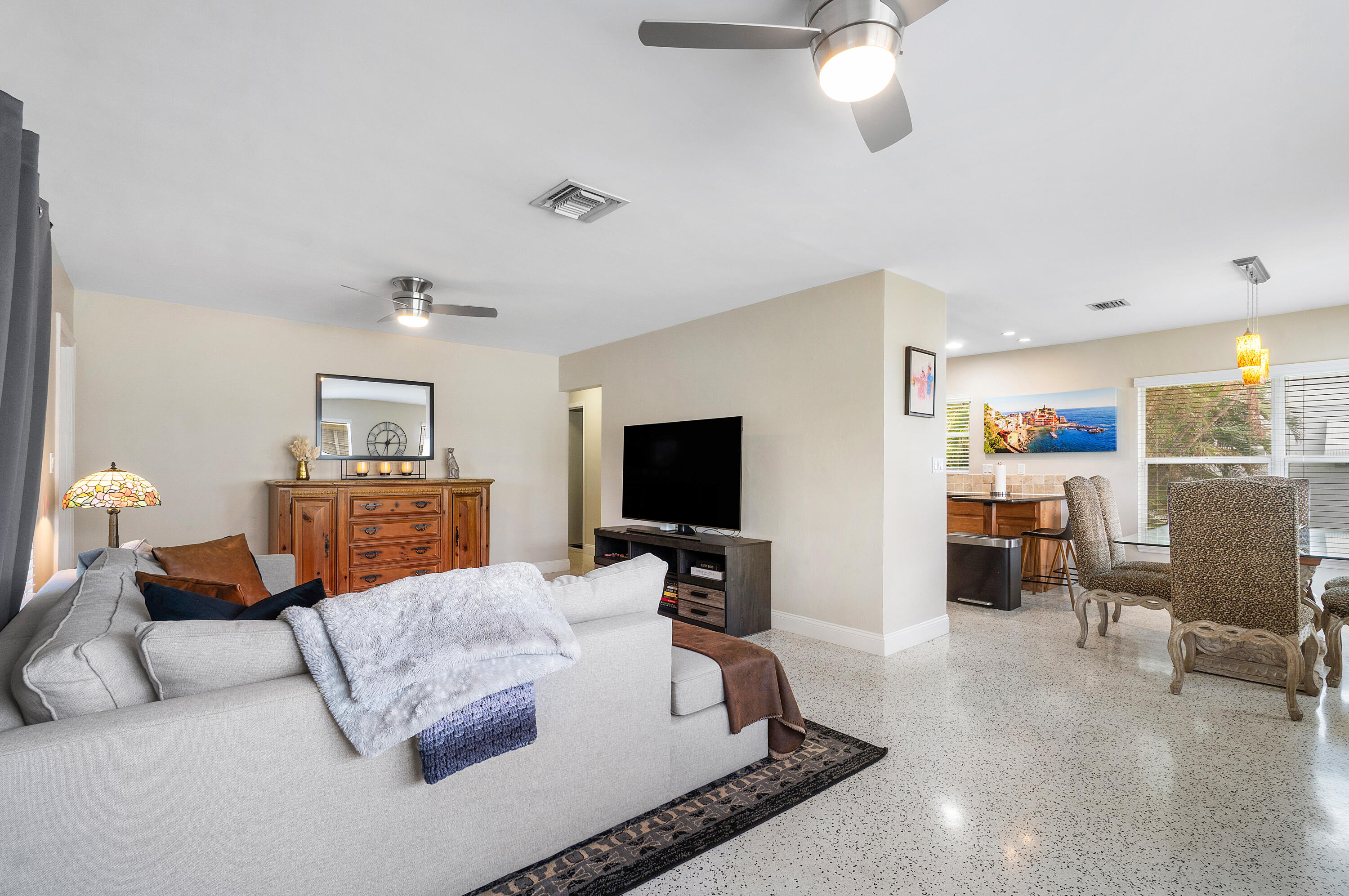 2757 Northeast 29th Avenue, Unit 2 Lighthouse Point, FL 33064 - Photo 9 of 29 a living room with furniture and a flat screen tv