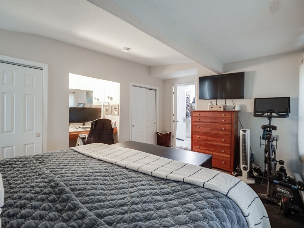 28 Mercer Street, Unit 2 Boston, MA 02127 - Photo 14 of 23 a bedroom with a bed and a flat tv screen on dresser