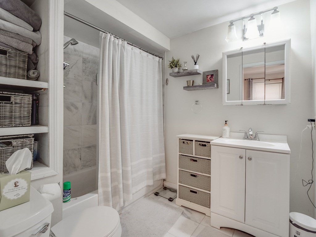 28 Mercer Street, Unit 2 Boston, MA 02127 - Photo 17 of 23 a bathroom with a sink toilet and shower