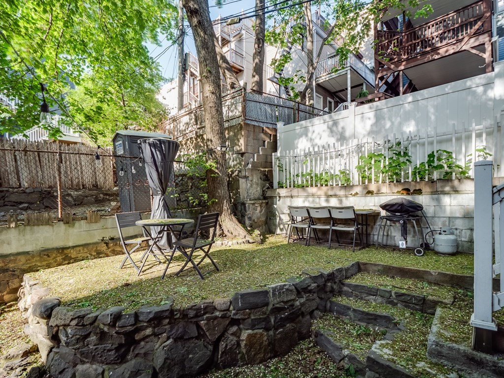 28 Mercer Street, Unit 2 Boston, MA 02127 - Photo 21 of 23 a view of a backyard with sitting area and furniture