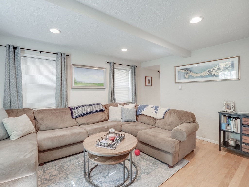 28 Mercer Street, Unit 2 Boston, MA 02127 - Photo 3 of 23 a living room with furniture and a wooden floor