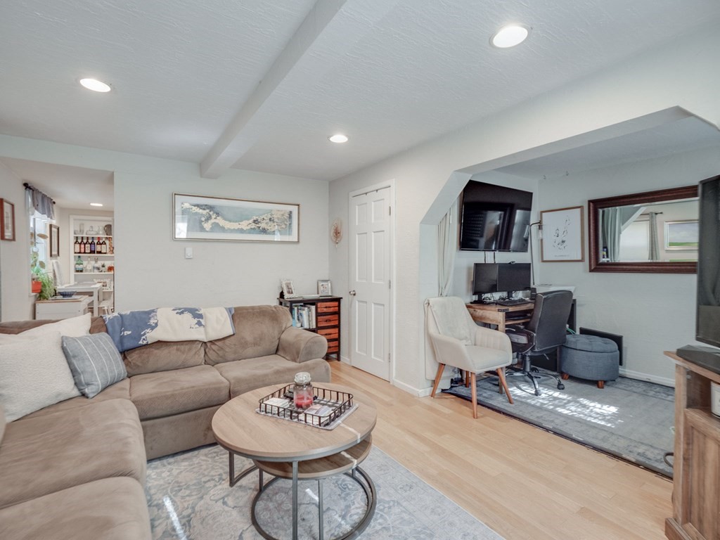 28 Mercer Street, Unit 2 Boston, MA 02127 - Photo 4 of 23 a living room with furniture a rug and a table