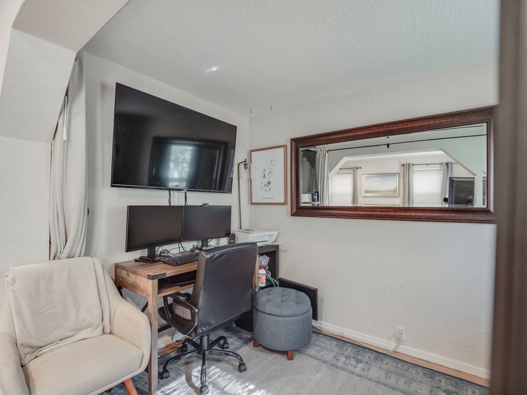 28 Mercer Street, Unit 2 Boston, MA 02127 - Photo 5 of 23 a work room with furniture and a flat screen tv