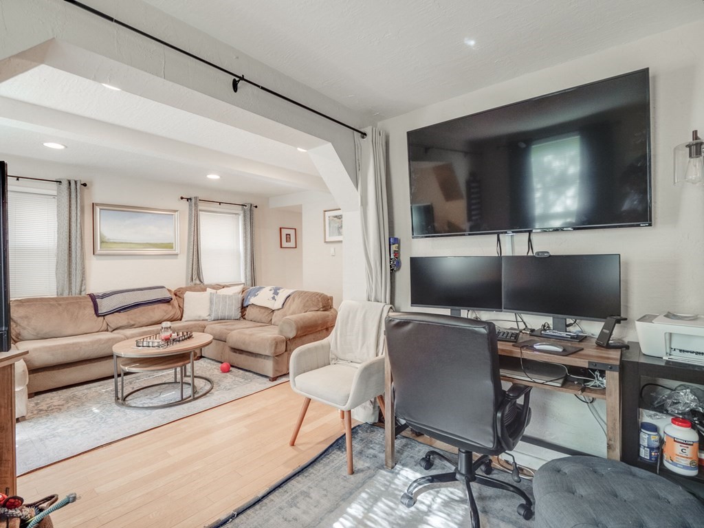28 Mercer Street, Unit 2 Boston, MA 02127 - Photo 7 of 23 a living room with furniture and a flat screen tv