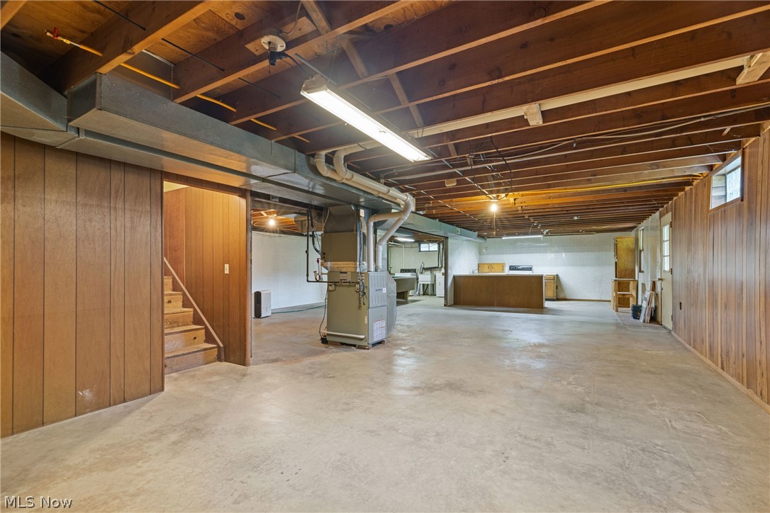16295 Sperry Road Vermilion, OH 44089 - Photo 30 of 48 Basement featuring wood walls and heating utilities