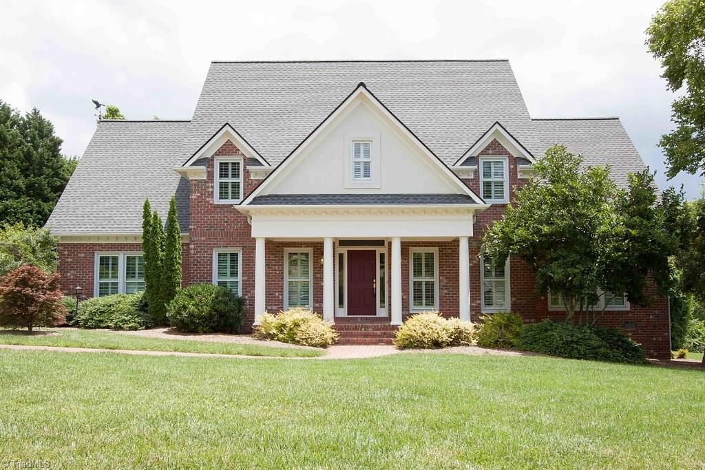 6104 Gwynedd Road Summerfield, NC 27358 - Photo 1 of 30 Undeniable curb appeal! Classic architecture nestled among exceptional landscaping.
