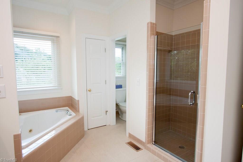 6104 Gwynedd Road Summerfield, NC 27358 - Photo 17 of 30 Shower as well as soaking tub in master bath. Private WC.
