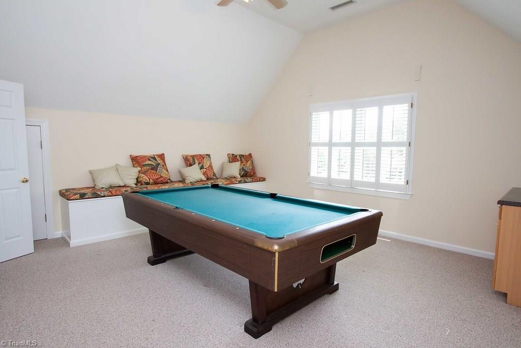 6104 Gwynedd Road Summerfield, NC 27358 - Photo 25 of 30 Pool room featuring built-in seating/storage.