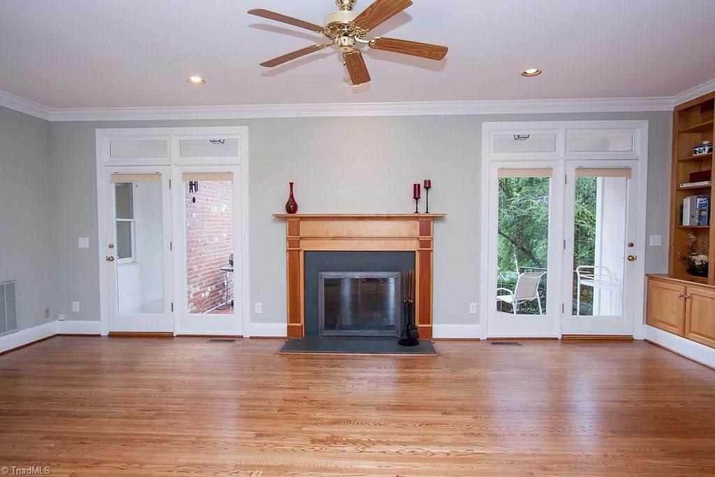 6104 Gwynedd Road Summerfield, NC 27358 - Photo 3 of 30 Expansive family room with French door access to covered porch and charming garden.