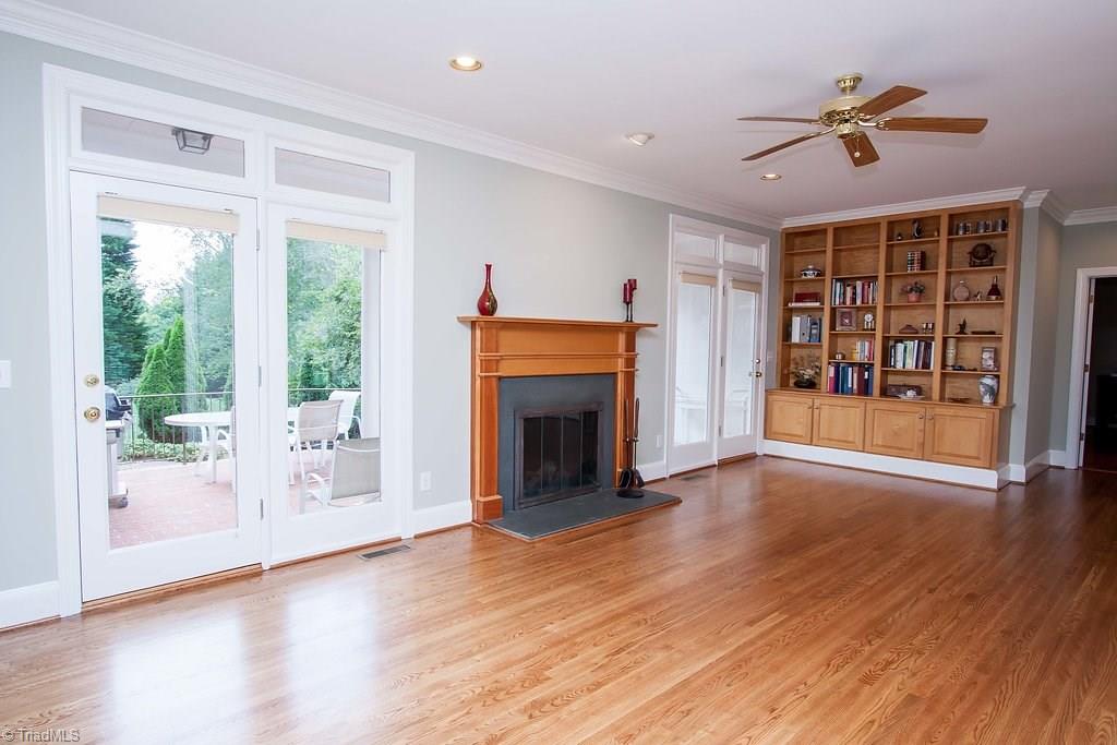 6104 Gwynedd Road Summerfield, NC 27358 - Photo 4 of 30 Built-ins in fireside family room. Newly refinished floors bring elegance and beauty to interiors.