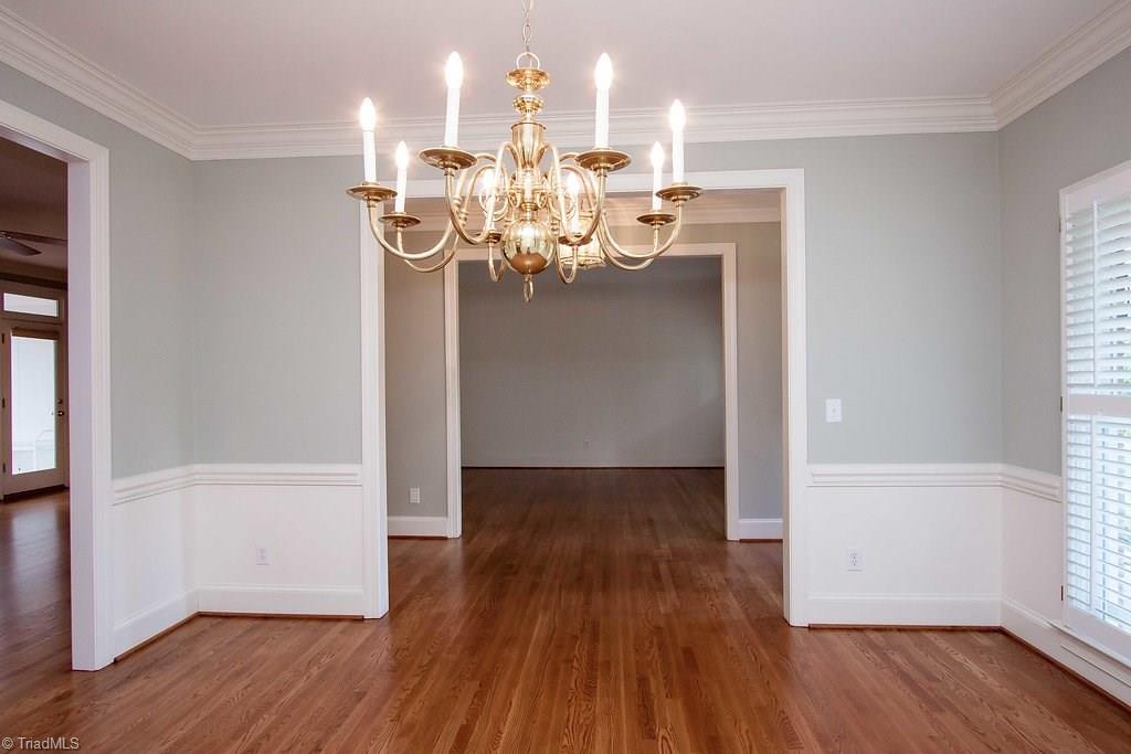 6104 Gwynedd Road Summerfield, NC 27358 - Photo 6 of 30 Soft blue/gray walls are enhanced by traditional lighting.