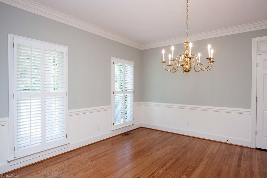 6104 Gwynedd Road Summerfield, NC 27358 - Photo 7 of 30 Natural light is abundant with floor length windows.