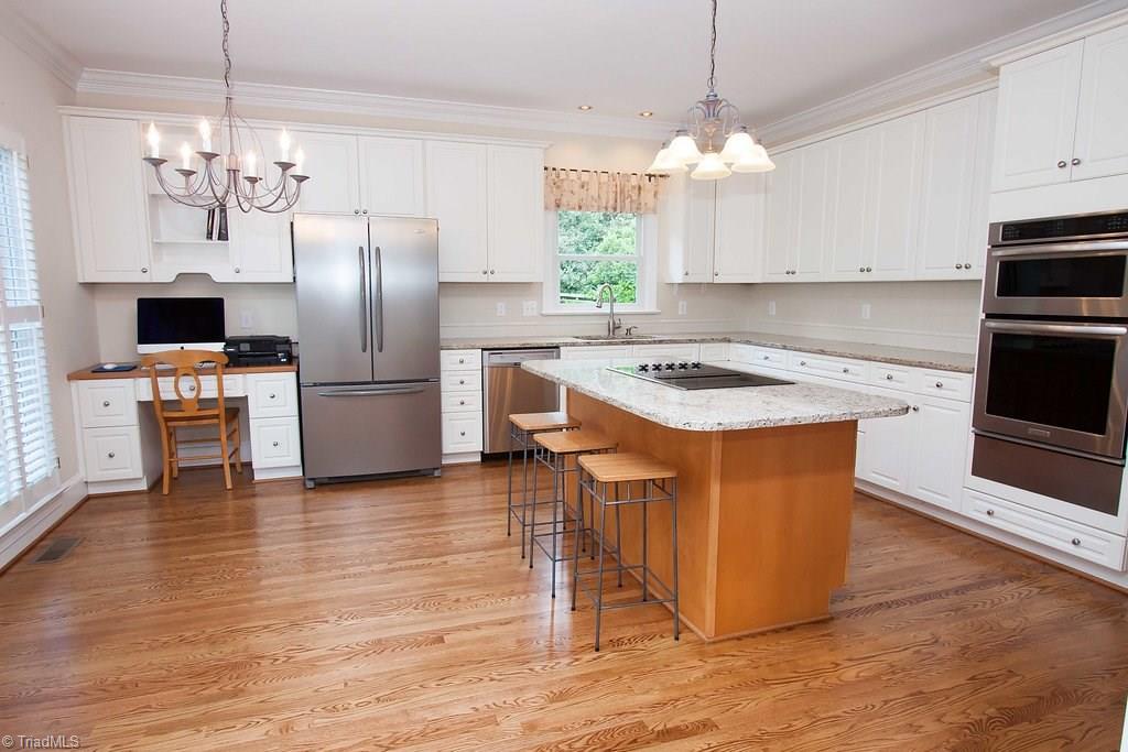 6104 Gwynedd Road Summerfield, NC 27358 - Photo 8 of 30 Gather round this kitchen! Designed to handle large crowds, quick snacks or multiple cooks. There's plenty of room for all!