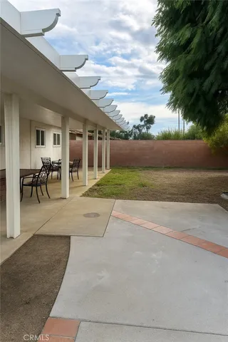 a house view with a backyard space