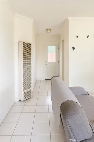 a spacious bedroom with a bed and a window