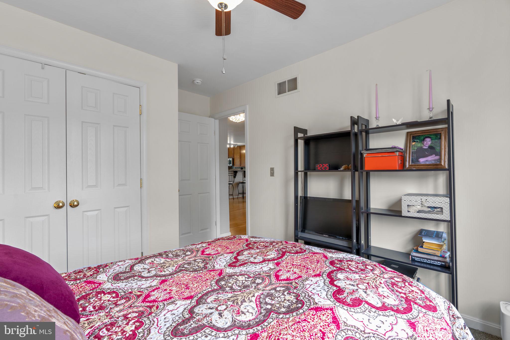8057 Mayer Avenue Pasadena, MD 21122 - Photo 15 of 26 a bedroom with a bed and a television