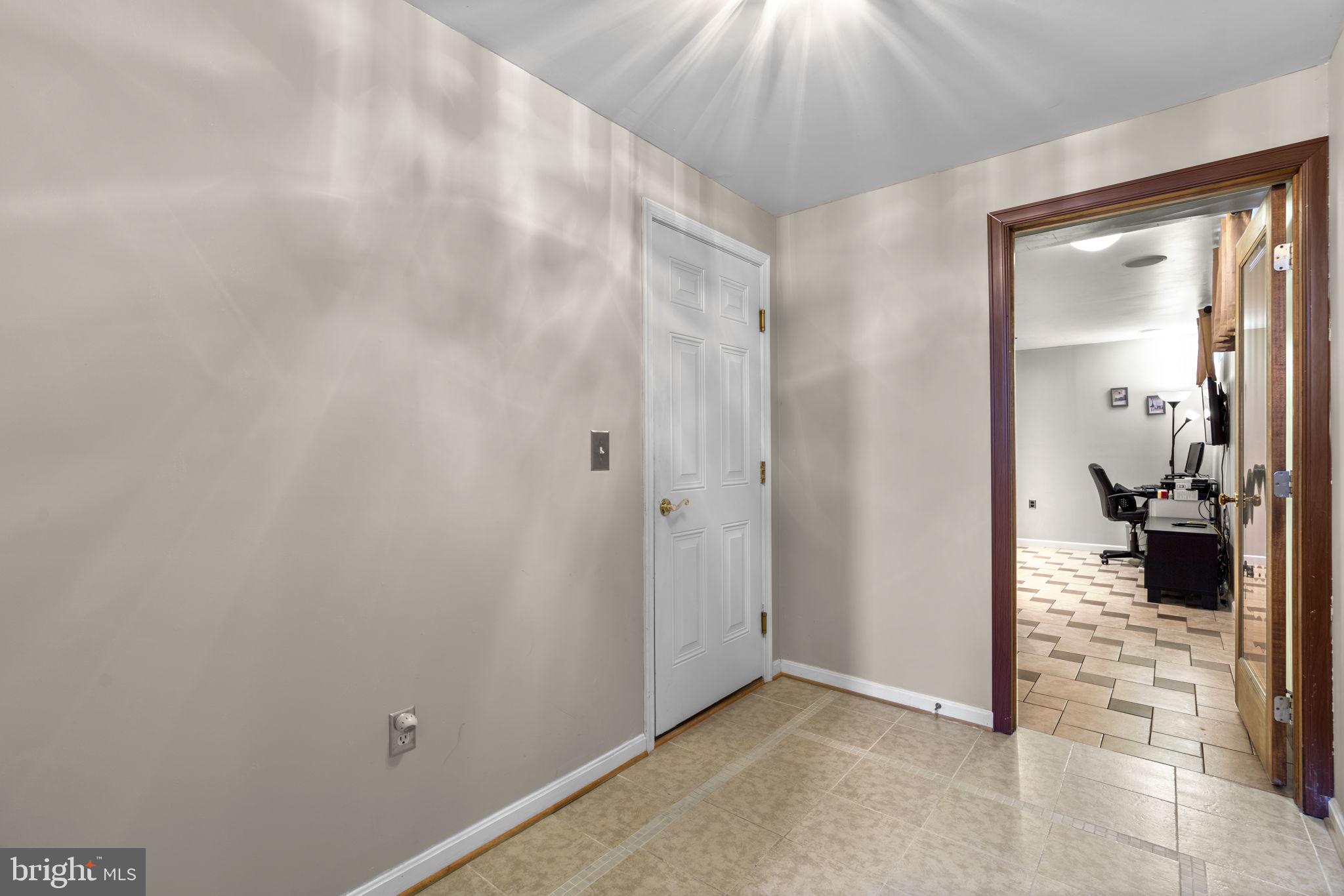 8057 Mayer Avenue Pasadena, MD 21122 - Photo 19 of 26 a view of a livingroom and a hallway