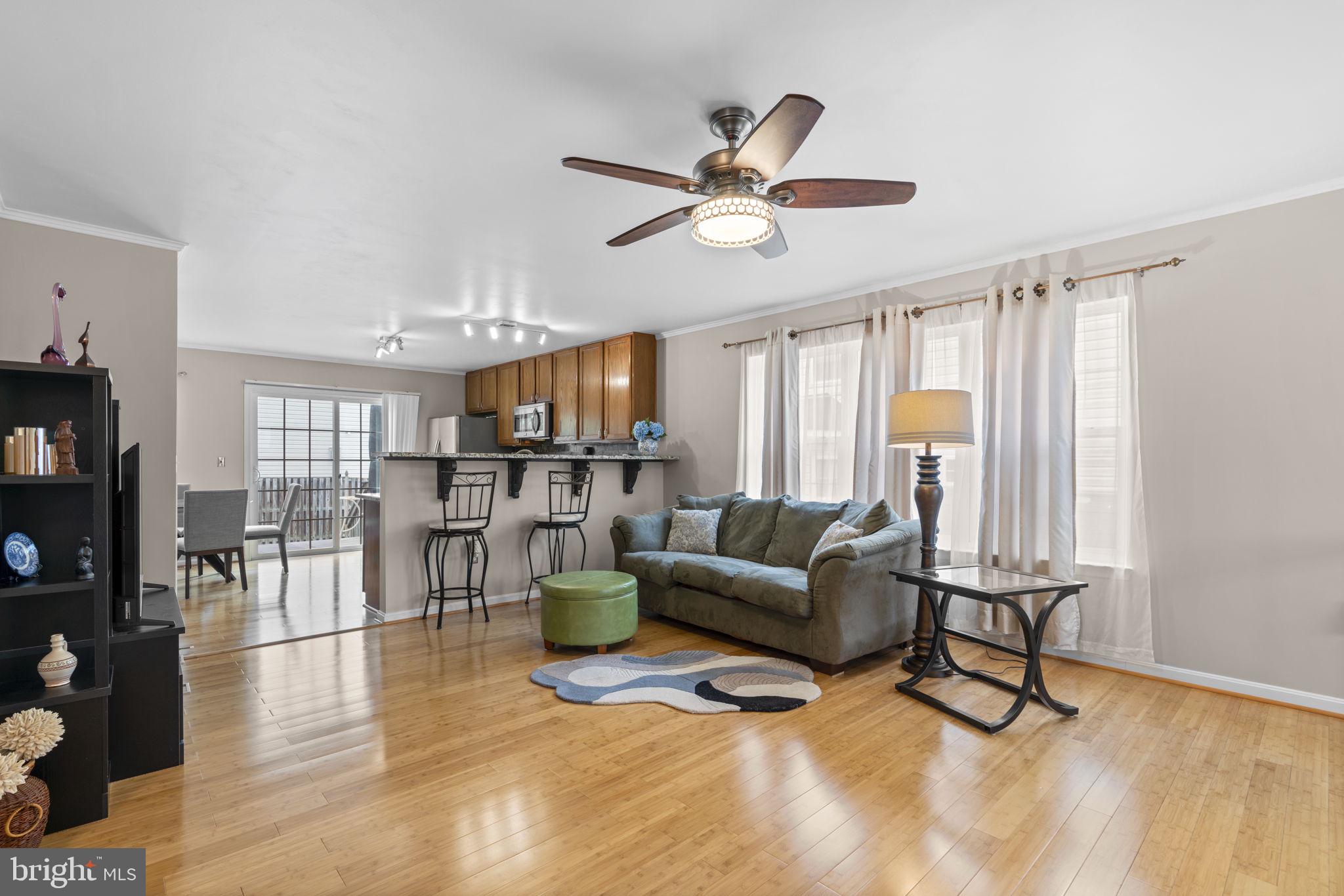 8057 Mayer Avenue Pasadena, MD 21122 - Photo 2 of 26 a living room with furniture and a large window