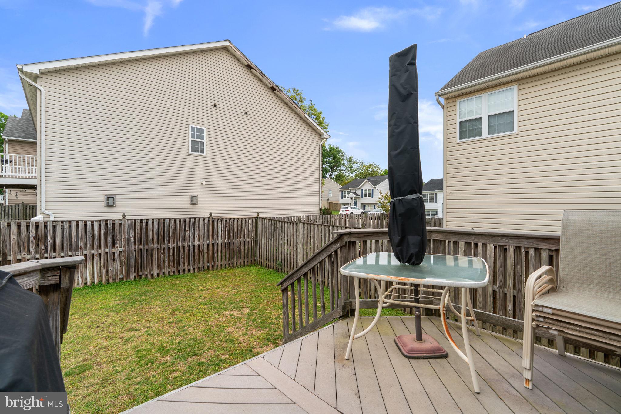 8057 Mayer Avenue Pasadena, MD 21122 - Photo 26 of 26 a view of a house with backyard and sitting area