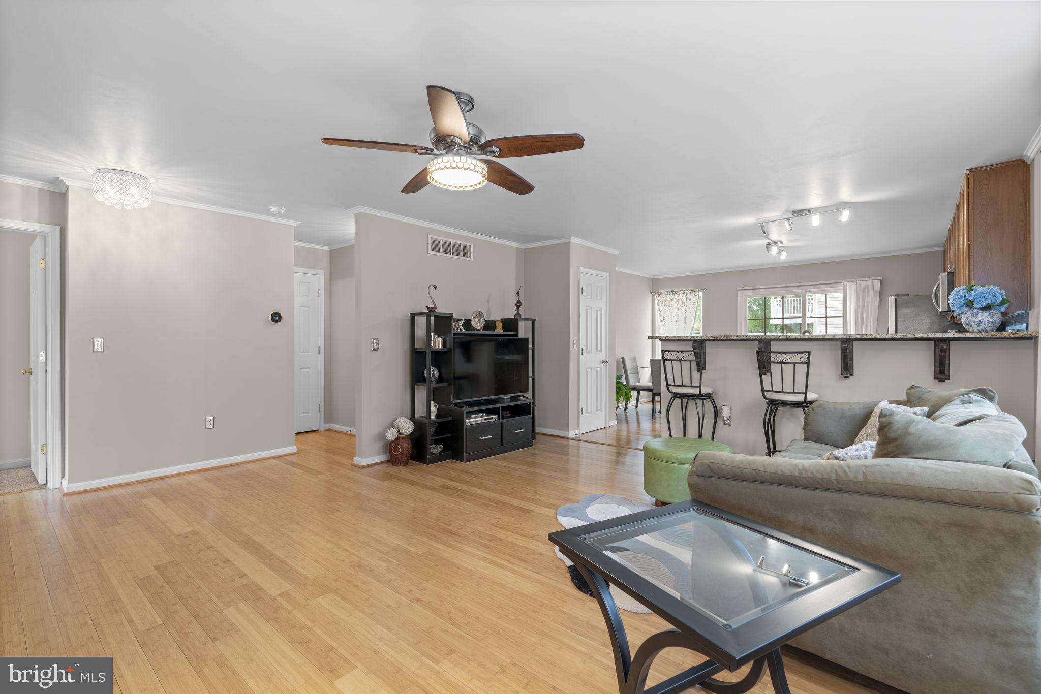 8057 Mayer Avenue Pasadena, MD 21122 - Photo 3 of 26 a living room with furniture and a wooden floor