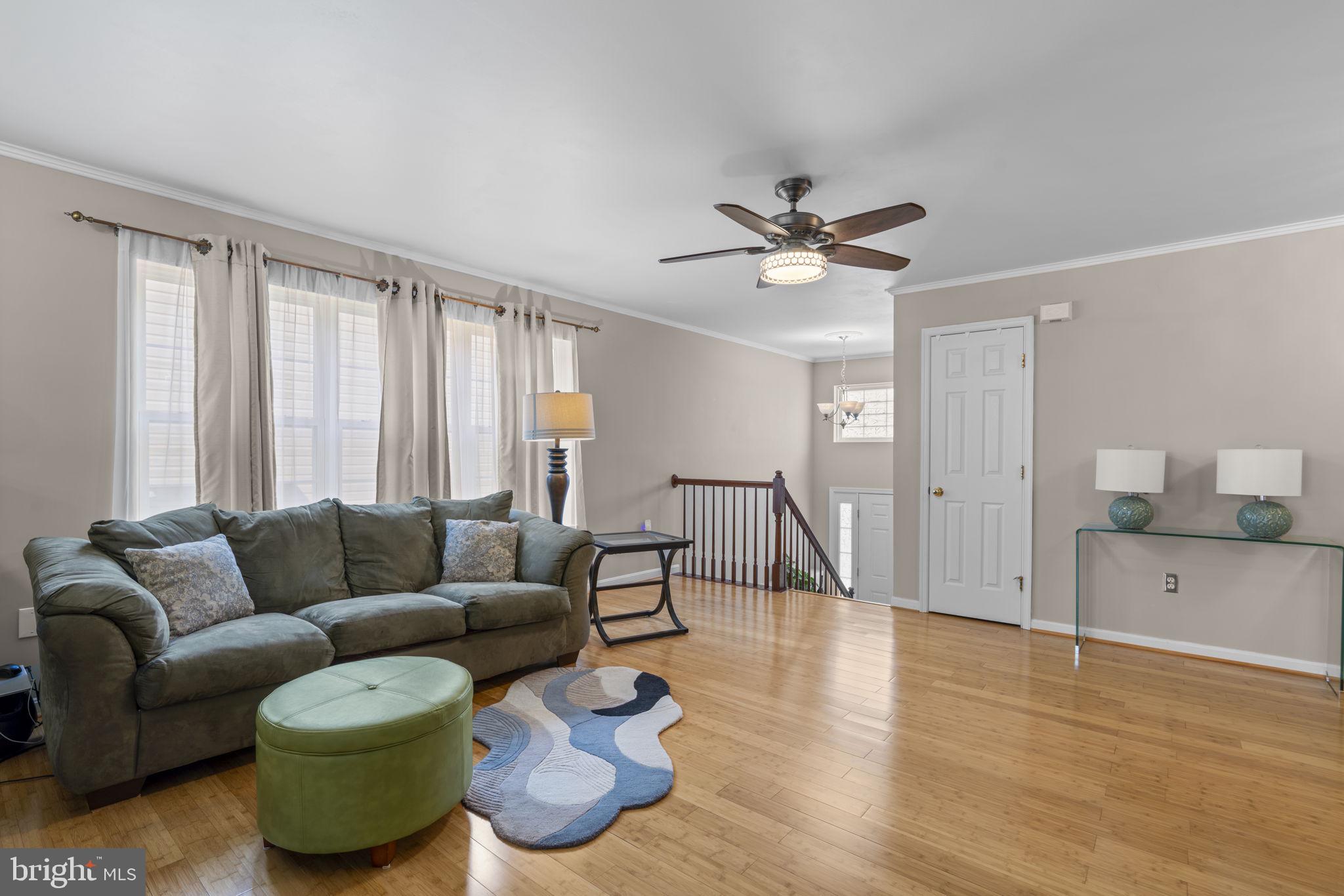 8057 Mayer Avenue Pasadena, MD 21122 - Photo 4 of 26 a living room with furniture and a large window