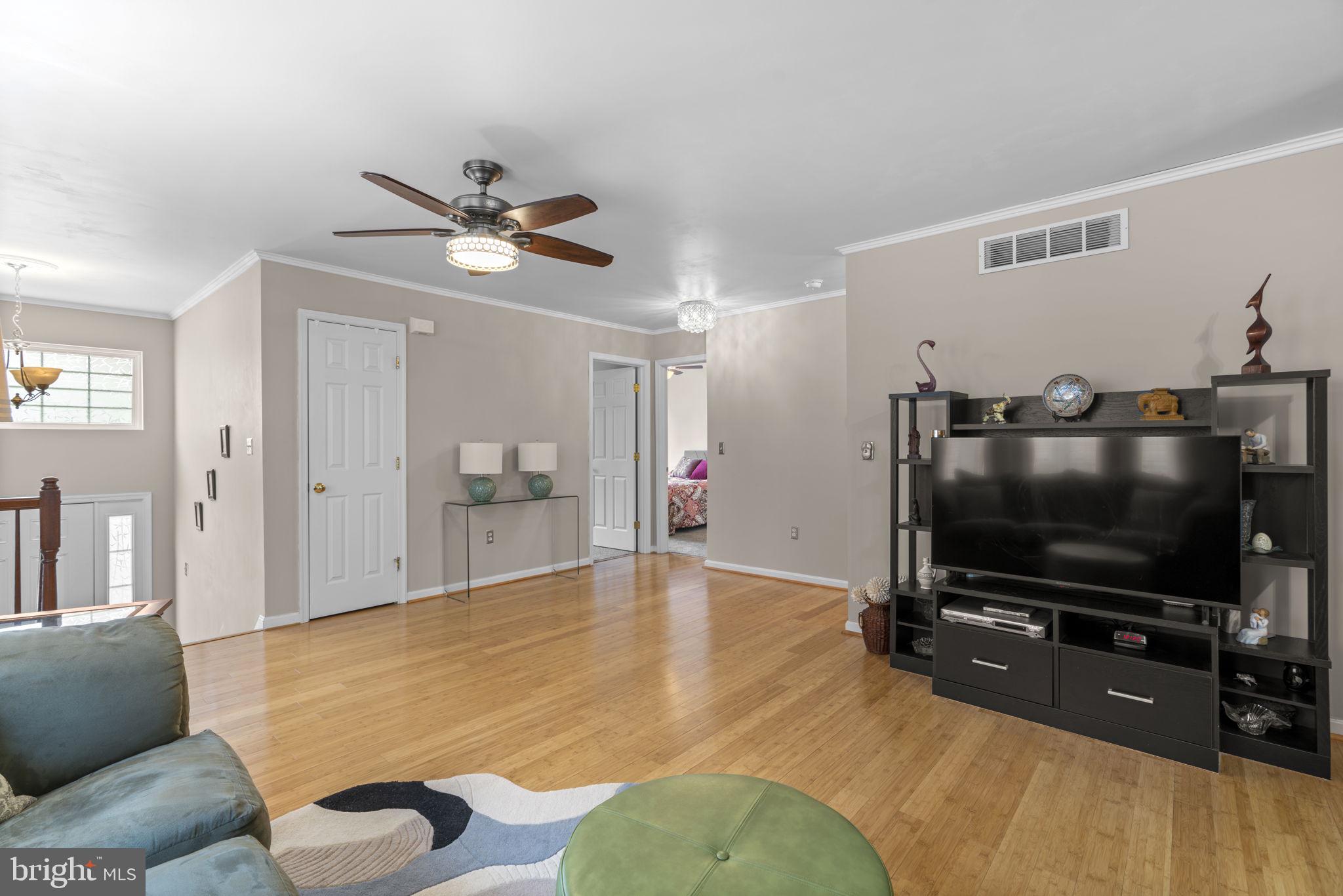 8057 Mayer Avenue Pasadena, MD 21122 - Photo 5 of 26 a living room with furniture and a flat screen tv