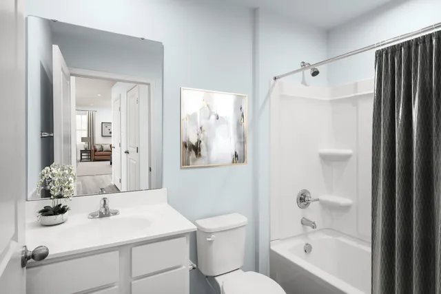 a bathroom with a sink toilet tub and shower