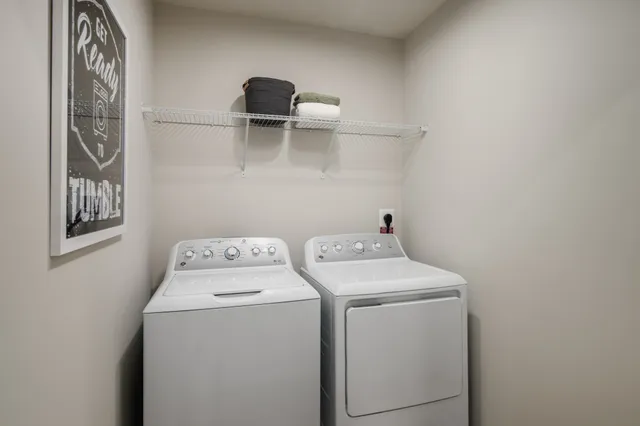 a utility room with dryer and washer