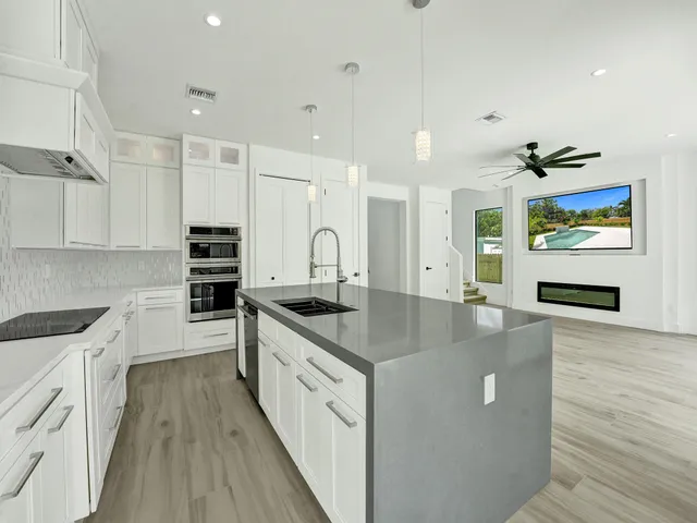 a bathroom with a toilet a sink and bathtub