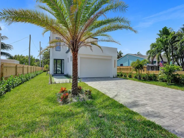 an empty room with a painting on the wall