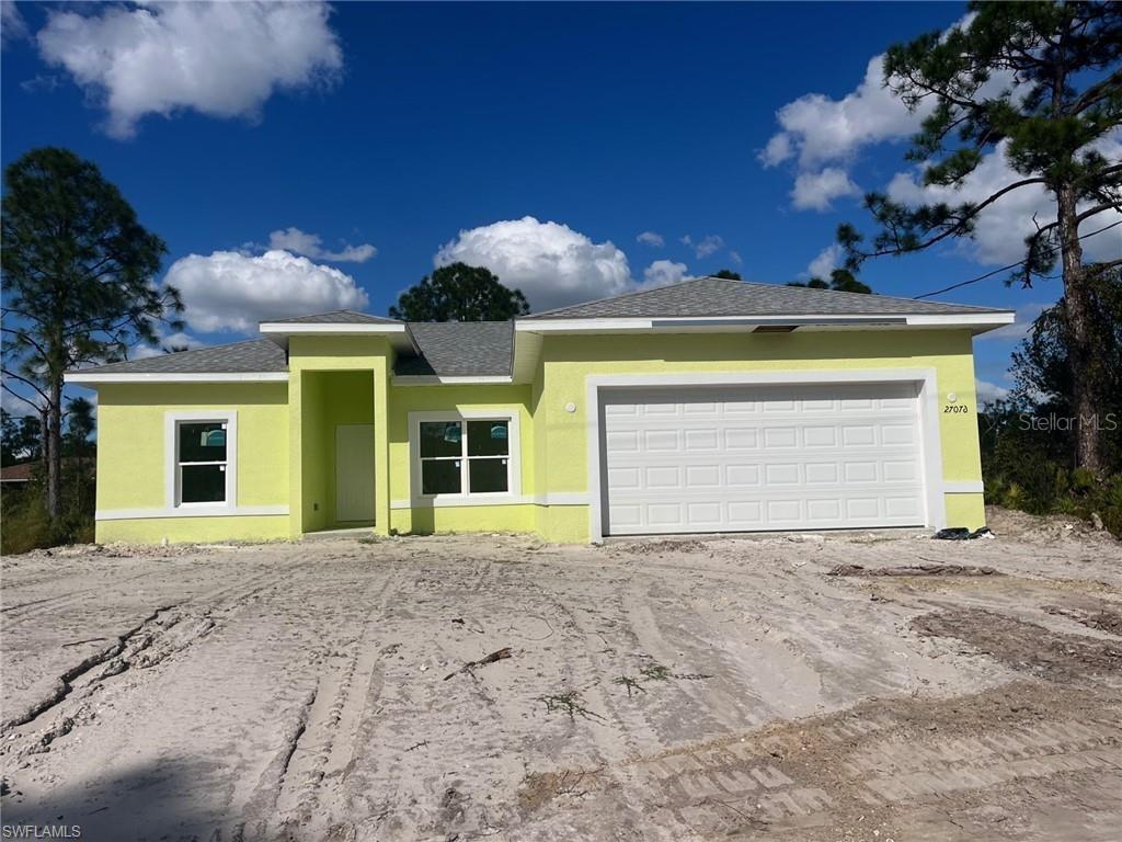Undisclosed Address Punta Gorda, FL 33955 - Photo 1 of 1 a front view of a house with a yard and garage